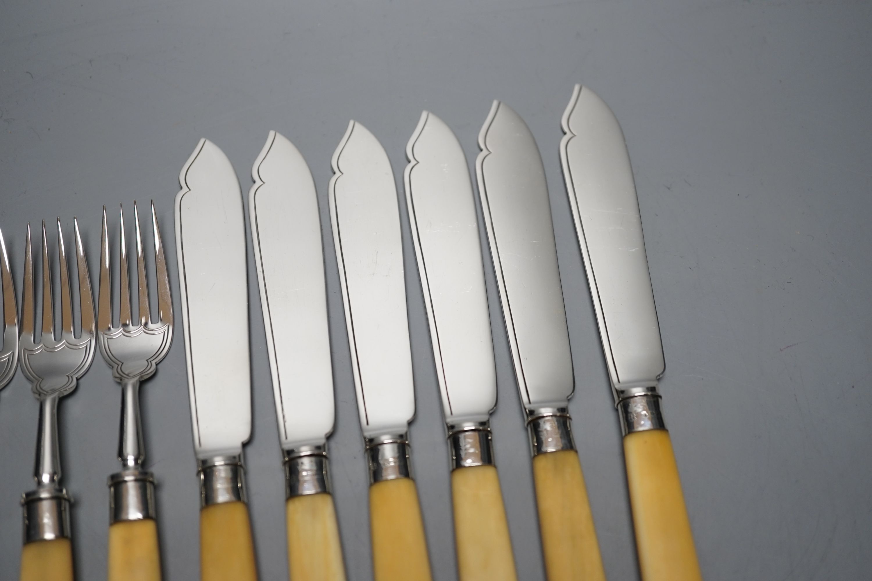 Six pairs of George V ivory handled silver fish eaters, Goldsmiths & Silversmiths Co Ltd, Sheffield, 1926, knife 21cm.